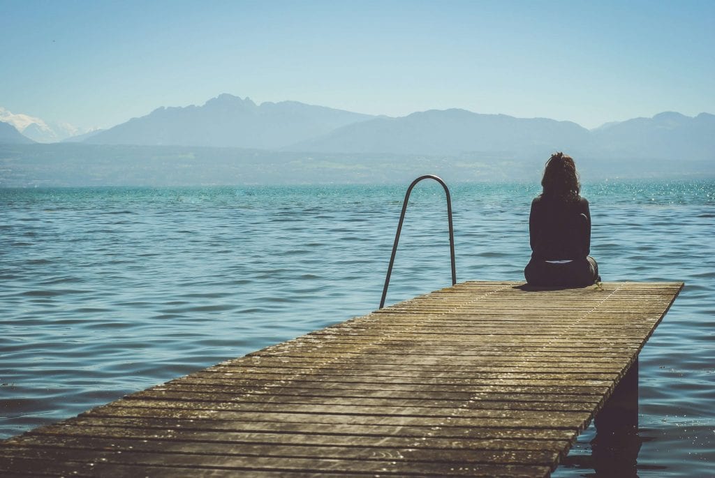 sad woman at the lake