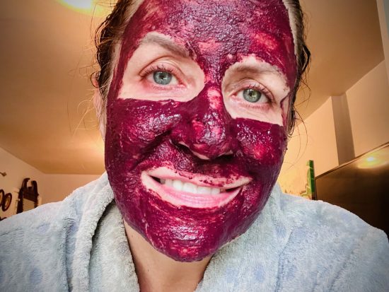 woman with hibiscus face mask 