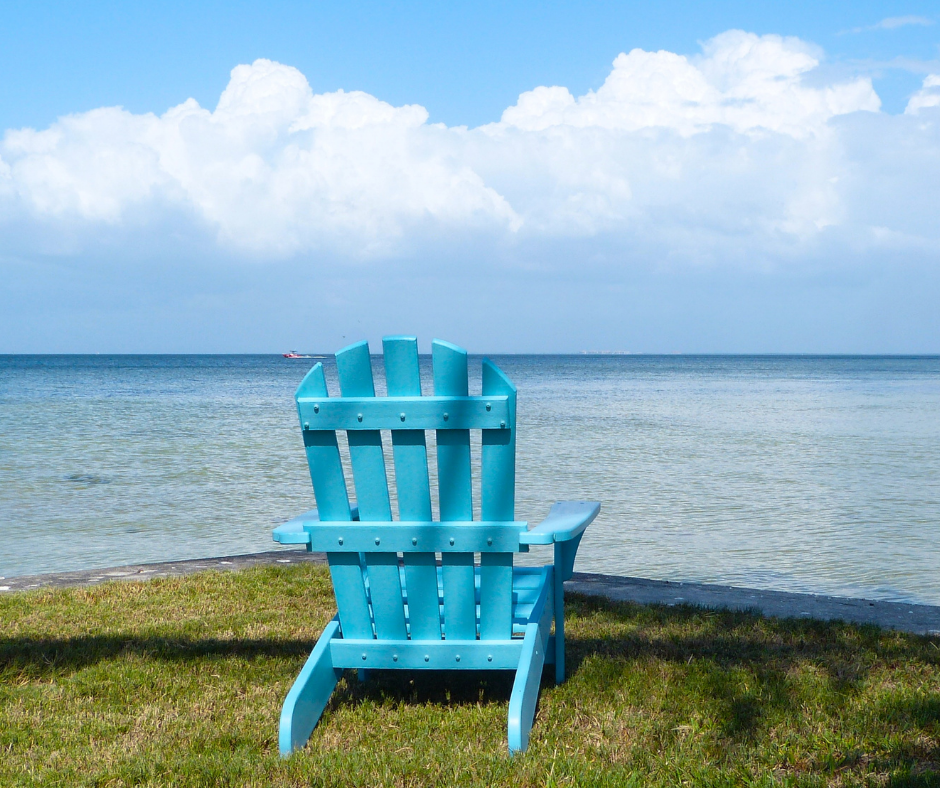 Adirondack chair facing a lake